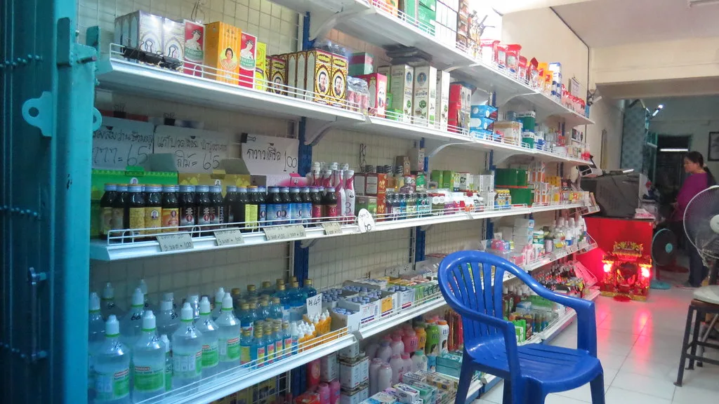 Shelves of a local pharmacy in Bangkok stocked with everyday medicines and travel remedies — Photo: kthypryn (CC BY 2.0)