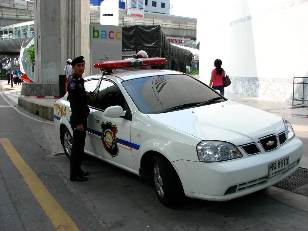 A Thai Tourist Police patrol car and officer on duty in central Bangkok — Photo: Highway Patrol Images (CC BY 2.0)
