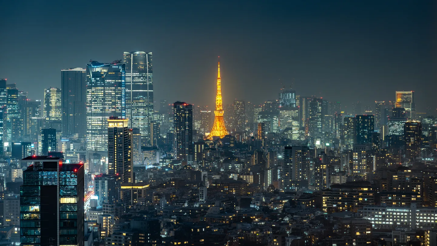 Azabudai Hills towers and Tokyo Tower at night — the neighbourhood of teamLab Borderless — Photo: David Kernan (CC BY 4.0)