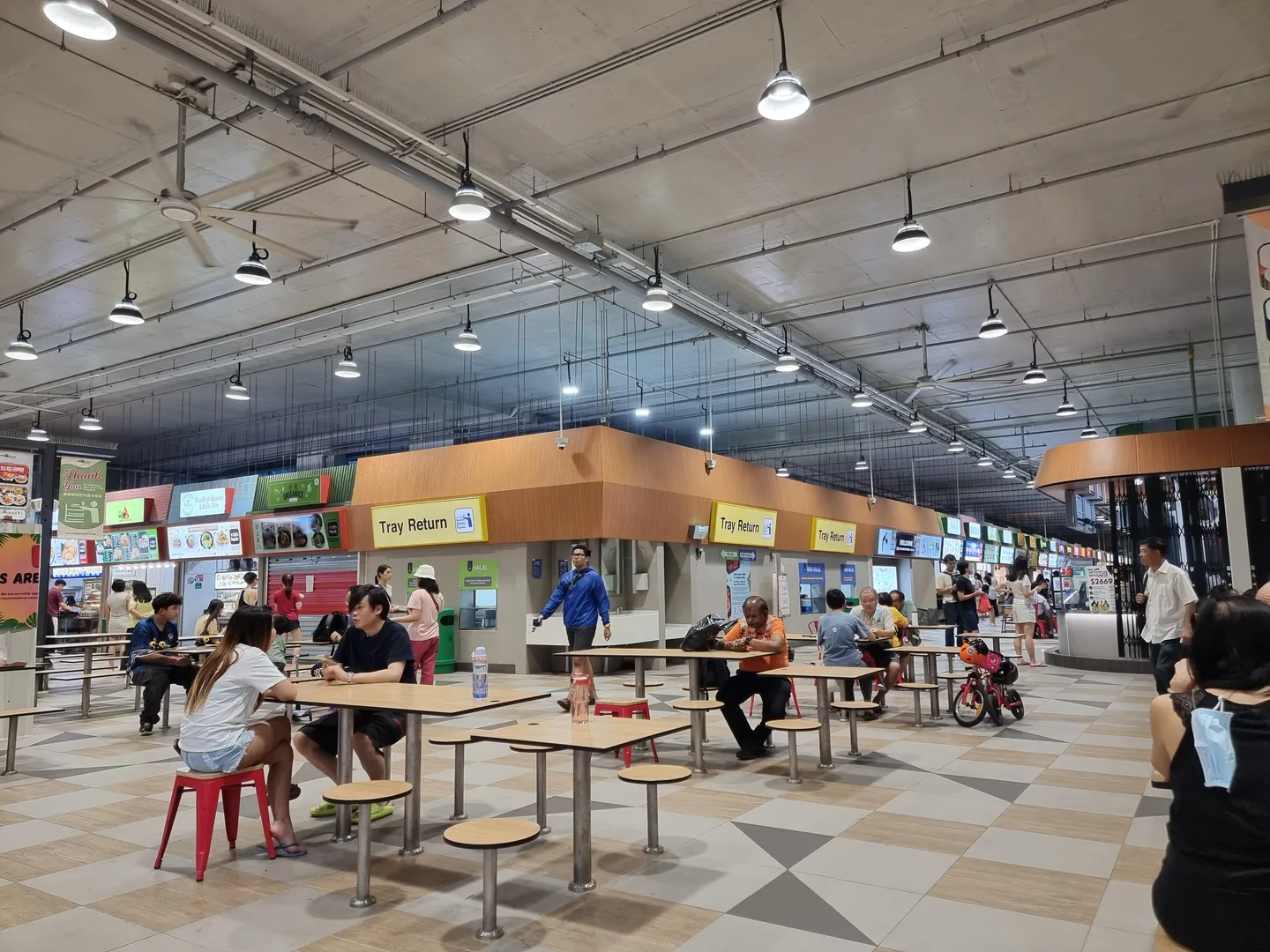 Inside a Singapore hawker centre — self-service dining carries no service charge and no tip is expected — Photo: Kbseah (CC BY-SA 4.0)